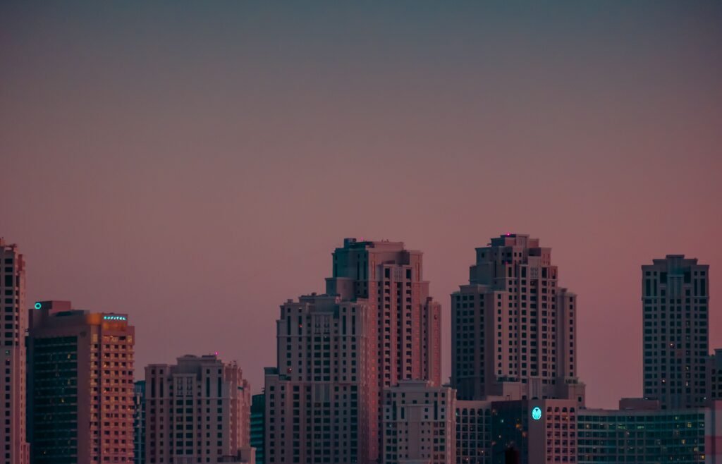 City skyline with modern skyscrapers at twilight capturing urban life.