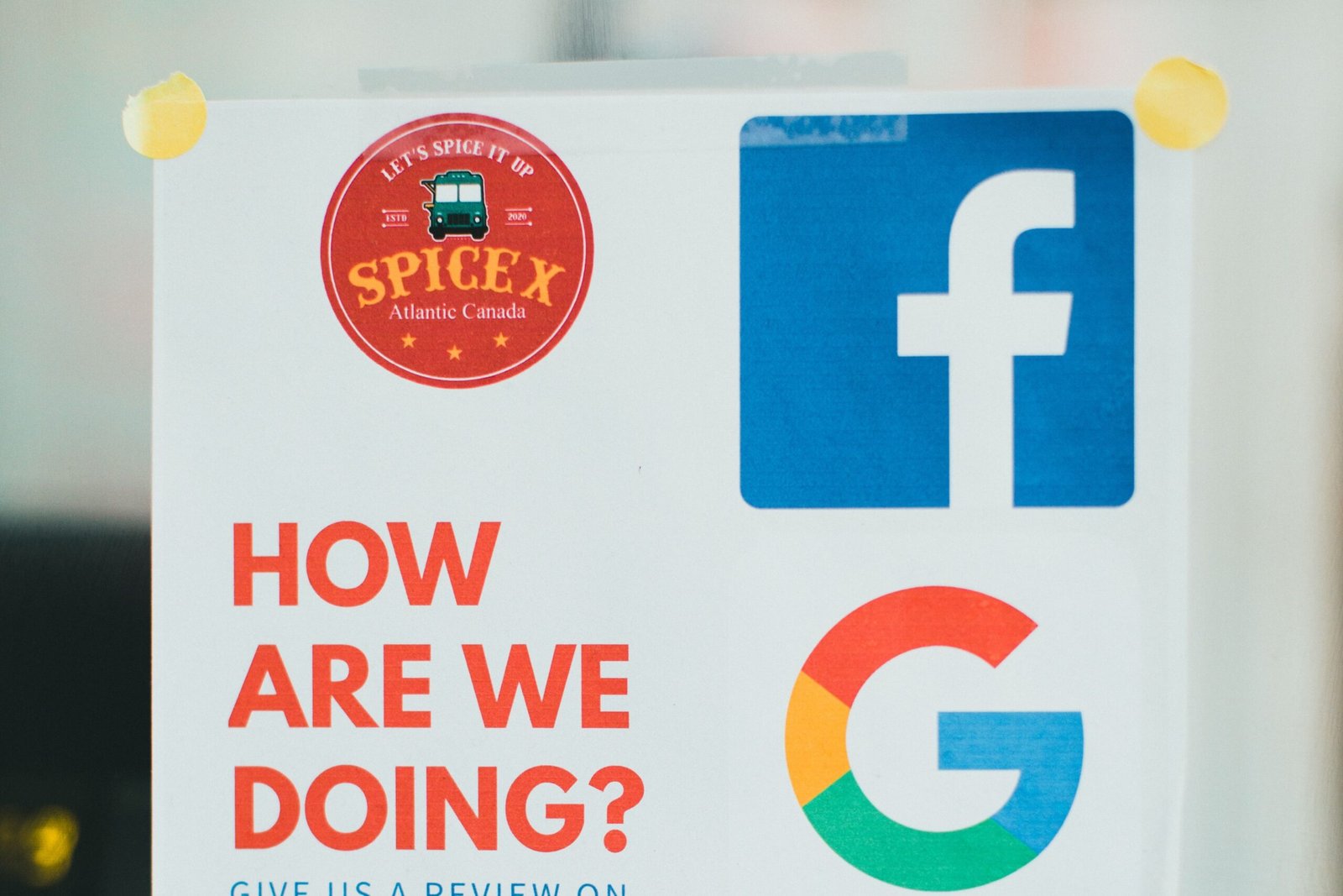 Poster encouraging reviews on Google, Facebook, and Instagram.